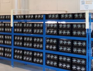 Racks of computers in an industrial warehouse